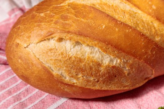 Fresh bread close-up on the fabric. fresh bakery. Fried crust