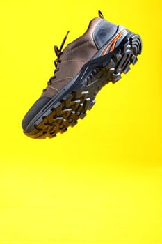 Men's shoes. Men's shoes, brown sneakers on a yellow background. High quality photo