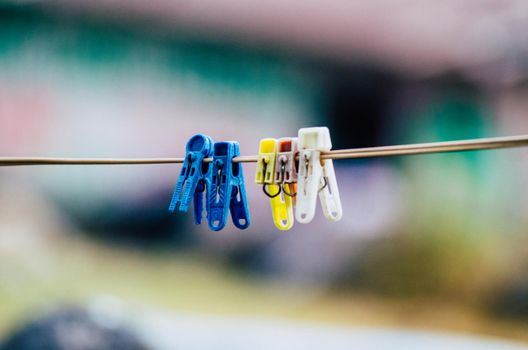 Plastic clothes pins, laundry hook, colorful, pegs ,outside ,hanged ,on the rope sunny clothing line