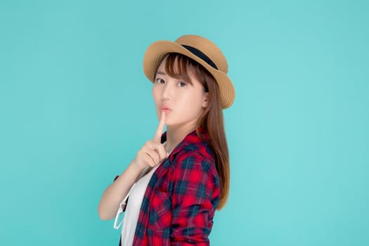 Beautiful portrait young asian woman wear hat having sunglasses confident and enjoy summer holiday isolated blue background, tourist model happy asia girl thinking idea planning travel concept.