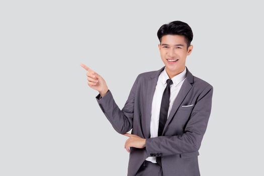 Portrait young asian business man pointing and presenting isolated on white background, advertising and marketing, executive and manager, male confident showing success, expression and emotion.
