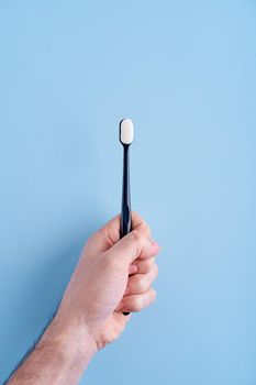 Fashionable toothbrush with soft bristles. Popular toothbrush. Hygiene trends.            