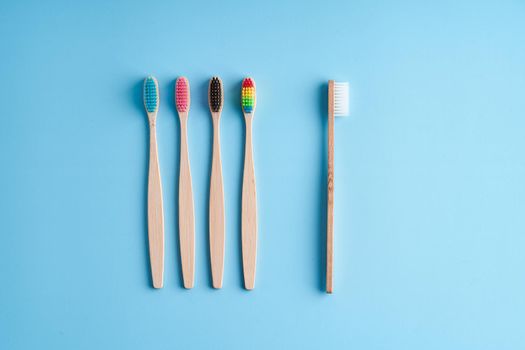 A bunch of eco-friendly bamboo toothbrushes. Global environmental trends. Gender and racial inequality. toothbrushes of different genders.