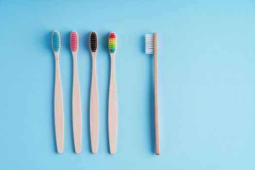 A bunch of eco-friendly bamboo toothbrushes. Global environmental trends. Gender and racial inequality. toothbrushes of different genders.