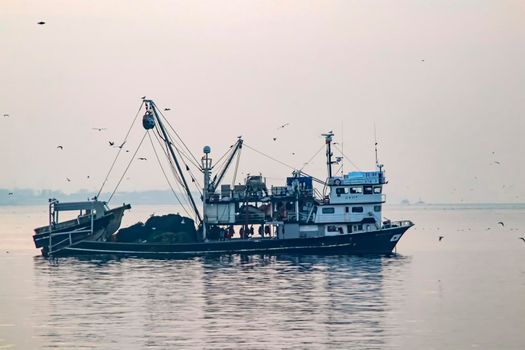 istanbul,turkey-april 2,2021. fishing season and fishing boats at marmara sea in kumkapi district.