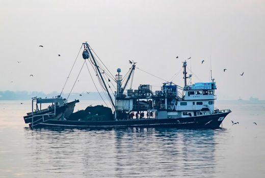 istanbul,turkey-april 2,2021. fishing season and fishing boats at marmara sea in kumkapi district.