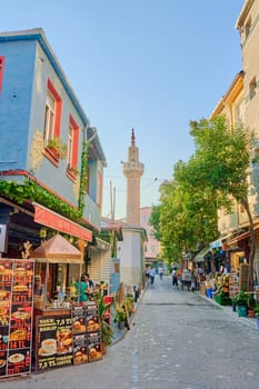 Walking tour of istanbul. A small coffee shop on a cozy street overlooking the tower. Turkey , Istanbul - 21.07.2020