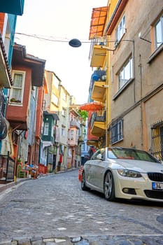 Authentic atmosphere of the old district in a Turkish city. Narrow street and old buildings. Turkey , Istanbul - 21.07.2020