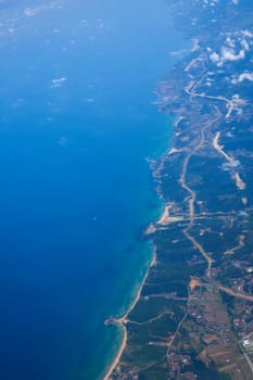 Daytime view from a flying plane at high altitude. Coast. Coastline of Turkey.