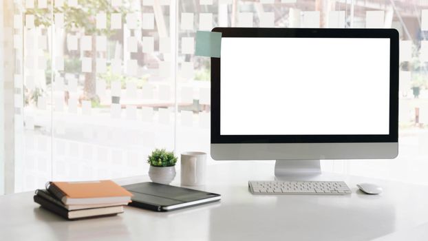 Blank computer desktop with keyboard, diary and other accesories
