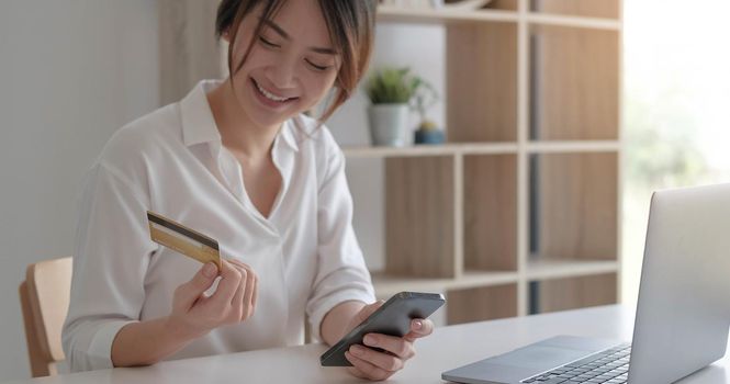 Mobile banking, Online shopping, digital banking, internet payment concept. Woman hand using mobile smart phone payments and credit card for online shopping
