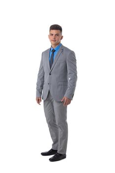 Full length portrait of a young business man in gray suit isolated on white background