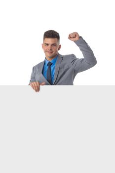 Young man in suit showing banner whiteboard sign isolated on white background