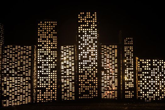 Cartoon style city buildings. Realistic city building miniatures with lights. background. Decorative city. Selective focus