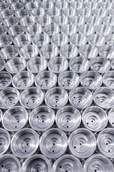 shiny steel industrial production parts after turning - close-up with selective focus