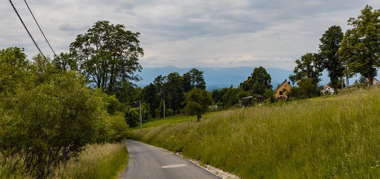 Long path with bushes and fields around in Kaczawskie mountains