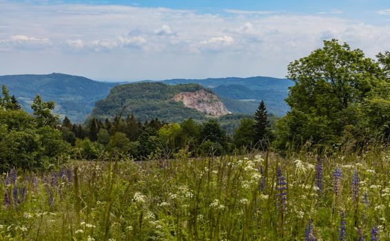 Beautiful panorama of Kaczawskie mountains with big fields and trees around