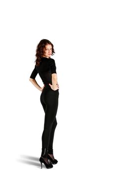 young beautiful woman in black suit posing standing in studio on white background