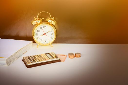 calculator, money and alarm clock old vintage gold over white and black background. with copy space add text retro style