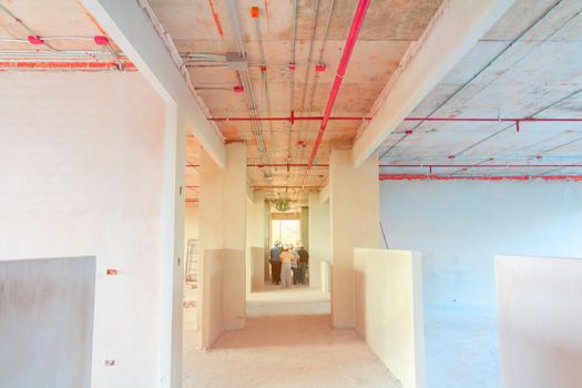 interior in construction and wall decoration at building site with engineer motion and tone light sunlight  morning