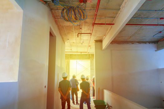 interior in construction and wall decoration at building site with engineer motion and tone light sunlight  morning