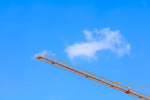 tower crane high on sky background