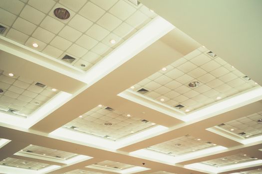 ceiling of business interior office building and light neon. vintage style tone with copy space add text