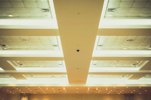 ceiling of business interior office building and light neon. vintage style tone with copy space add text