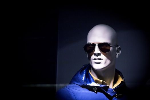 Portrait of a male mannequin with sunglasses. Copy space