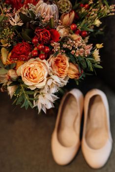 bridal bouquet in red autumn shades of Kenyan dried flowers