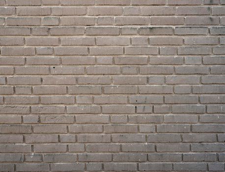 horizontal part of beige colored brick wall background