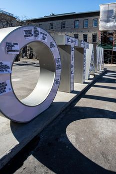Ottawa, Ontario, Canada - March 20, 2021: Signs left by protesters on the 'Ottawa' sign in the ByWard market carry messages condemning the prison system.