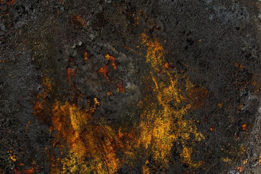 Bottom side of a cast iron pan with thicl layer of soot on its surface. Texture and background.