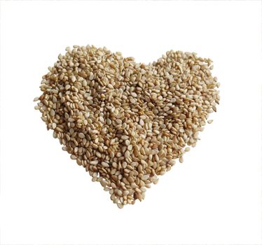 Sesame seeds in the form of heart on a white background