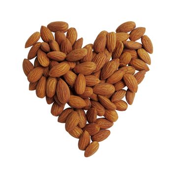 Peeled almonds closeup, heart shape background