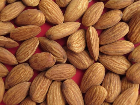 Peeled almonds closeup background