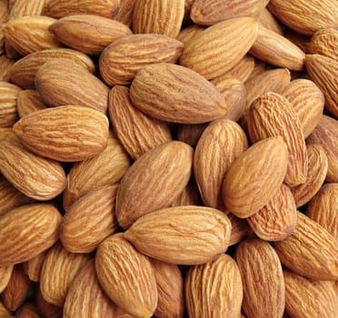Peeled almonds closeup background