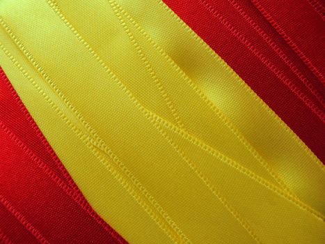 SPAIN flag or banner made with red and yellow ribbons