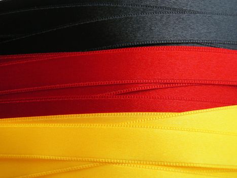 GERMANY flag or banner made with black, red and yellow ribbons