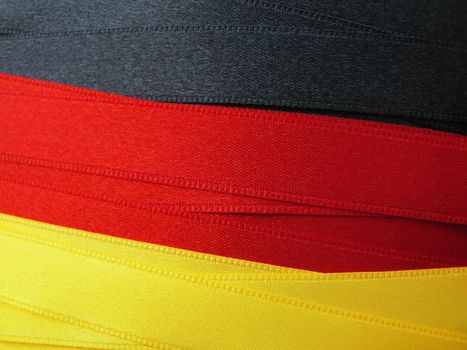 GERMANY flag or banner made with black, red and yellow ribbons