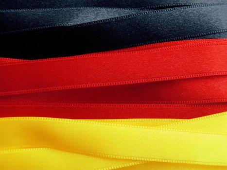 GERMANY flag or banner made with black, red and yellow ribbons