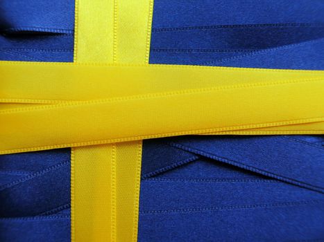 SWEDEN flag or banner made with blue and yellow ribbons