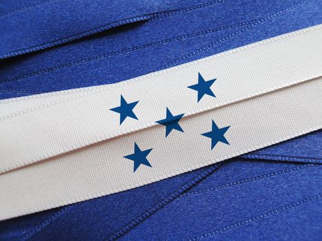 Honduras flag or banner made with blue and white ribbons