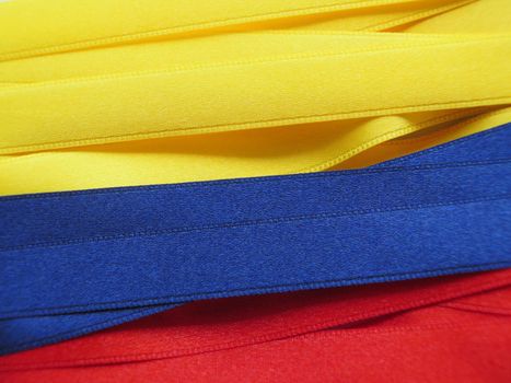 Colombia flag or banner made with Yellow, blue and red ribbons