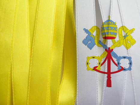 Vatican flag or banner made with Yellow and white ribbons