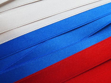 Russia flag or banner made with red, blue and white ribbons