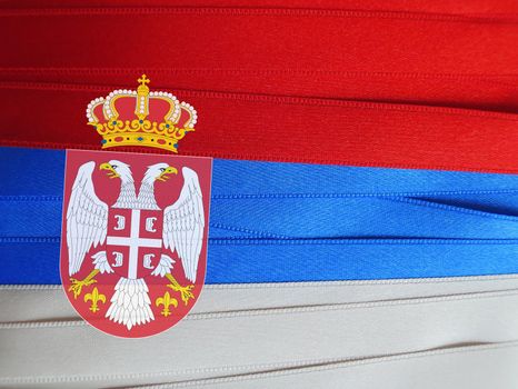 Serbia flag or banner made with red, blue and white ribbons