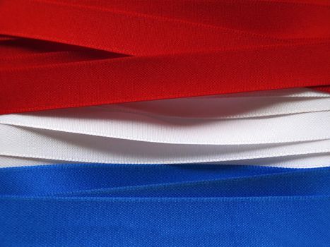 Luxembourg or Paraguay flag or banner made with red, blue and white ribbons