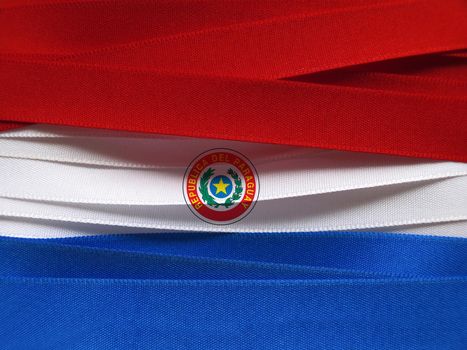 Paraguay flag or banner made with red, blue and white ribbons