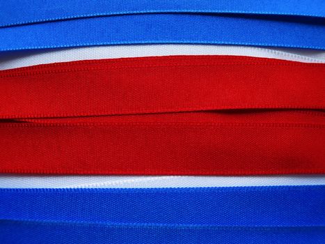 North Korea flag or banner made with red, blue and white ribbons